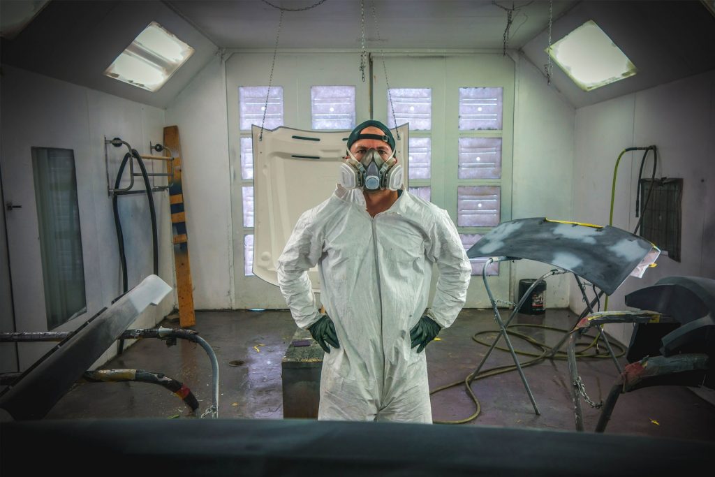 Local Collision Center Service Provider Worker Painting Vehicles